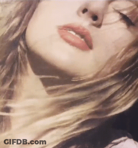 Woman With Eyes Closed And Hair In Wind GIF