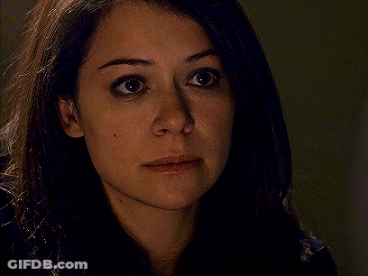 A Close Up Of A Woman 'S Face With Her Eyes Closed And Her Hair Blowing In The Wind . GIF