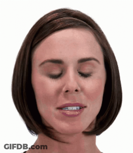 A Close Up Of A Woman 'S Face With Her Eyes Closed And Her Mouth Open GIF