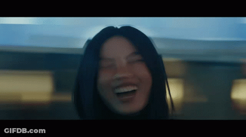 A Close Up Of A Woman 'S Face With Her Eyes Closed And Her Mouth Open GIF