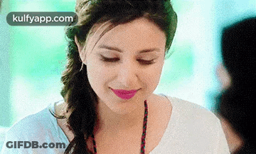 A Close Up Of A Woman 'S Face With Her Eyes Closed And Pink Lipstick . GIF