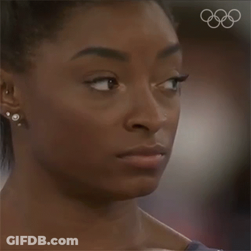 A Close Up Of A Woman 'S Face With Her Eyes Closed GIF