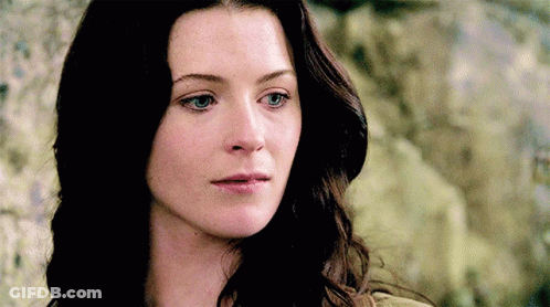 A Close Up Of A Woman 'S Face With Her Eyes Closed GIF