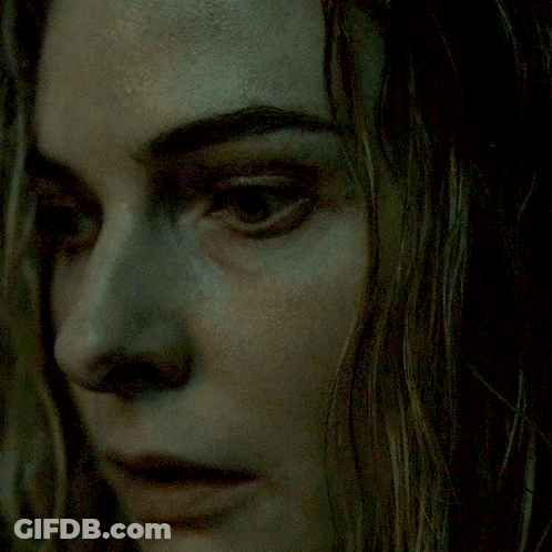 A Close Up Of A Woman 'S Face With Her Eyes Closed GIF