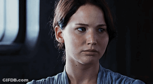 A Close Up Of A Woman 'S Face With Her Eyes Closed GIF