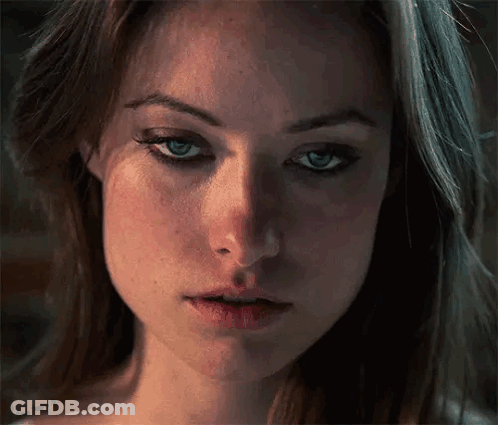A Close Up Of A Woman 'S Face With Her Eyes Closed . GIF