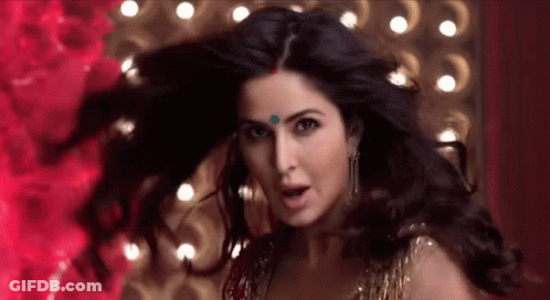 A Close Up Of A Woman 'S Face With Her Hair Flying In The Wind . GIF