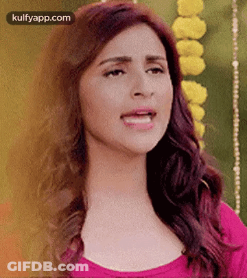 A Close Up Of A Woman 'S Face With Her Mouth Open . GIF