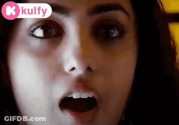 A Close Up Of A Woman 'S Face With Her Mouth Open And A Kolfy Logo In The Corner GIF