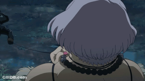 A Close Up Of A Woman 'S Face With Her Mouth Open And A Necklace Around Her Neck GIF