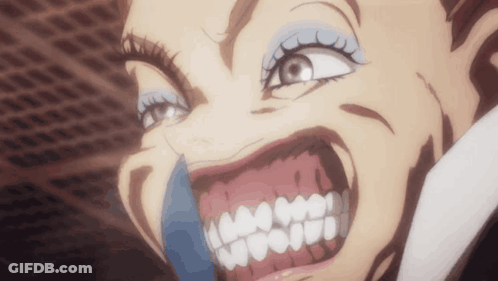A Close Up Of A Woman 'S Face With Her Mouth Open And Teeth Showing GIF