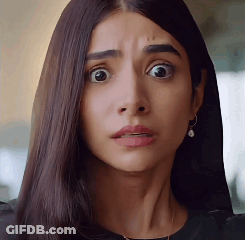 A Close Up Of A Woman 'S Face With Her Mouth Open GIF
