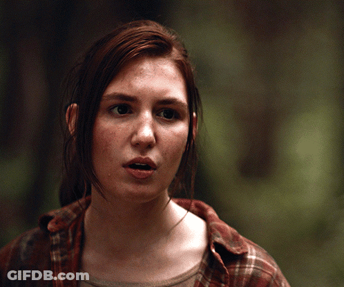 A Close Up Of A Woman 'S Face With Her Mouth Open GIF
