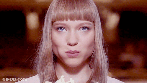 A Close Up Of A Woman 'S Face With Her Mouth Open GIF