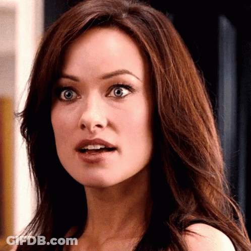A Close Up Of A Woman 'S Face With Her Mouth Open GIF