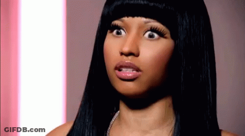 A Close Up Of A Woman 'S Face With Her Mouth Open GIF
