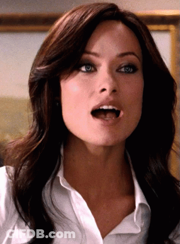 A Close Up Of A Woman 'S Face With Her Mouth Wide Open GIF
