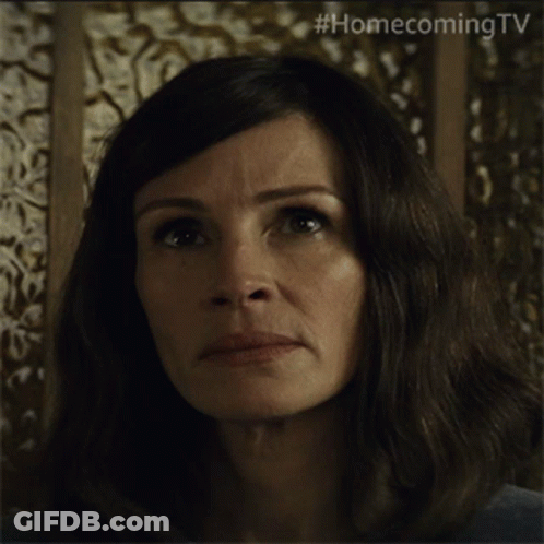 A Close Up Of A Woman 'S Face With #Homecomingtv Written On The Bottom GIF