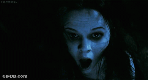 A Close Up Of A Woman 'S Face With Horrordoll Written In The Bottom Right Corner GIF