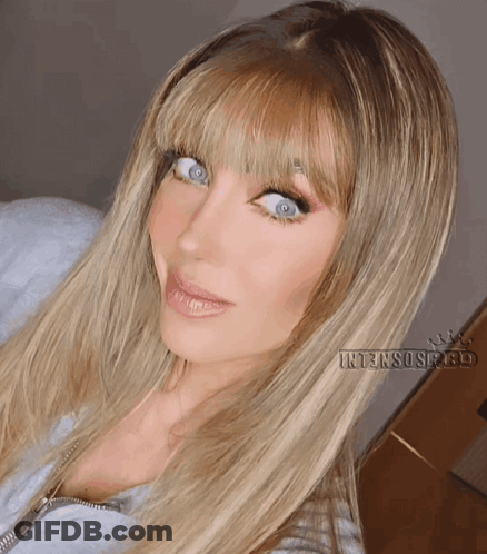 A Close Up Of A Woman 'S Face With Intensospeed Written Below Her GIF