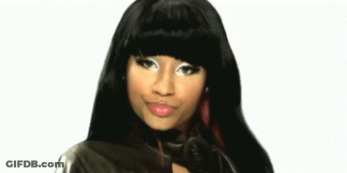 A Close Up Of A Woman 'S Face With Long Black Hair And A Leather Jacket . GIF