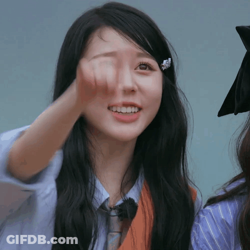 A Close Up Of A Woman 'S Face With Long Black Hair GIF