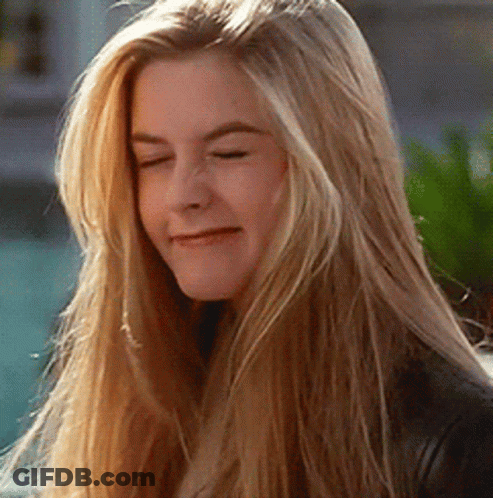 A Close Up Of A Woman 'S Face With Long Blonde Hair GIF