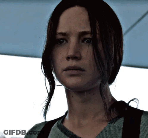 A Close Up Of A Woman 'S Face With Long Hair GIF
