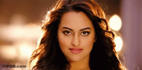 A Close Up Of A Woman 'S Face With Long Hair And A Serious Look On Her Face . GIF