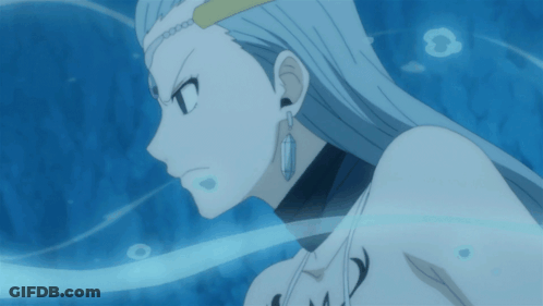 A Close Up Of A Woman 'S Face With Long White Hair And Earrings GIF