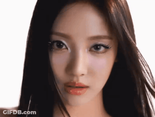 A Close Up Of A Woman 'S Face With Makeup On Her Eyes GIF