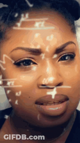 A Close Up Of A Woman 'S Face With Mathematical Symbols On It GIF