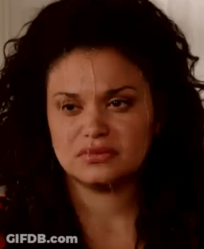 A Close Up Of A Woman 'S Face With Milk Dripping From Her Nose . GIF