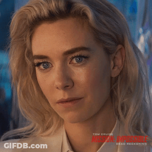 A Close Up Of A Woman 'S Face With Mission Impossible Dead Reckoning Written On The Bottom GIF