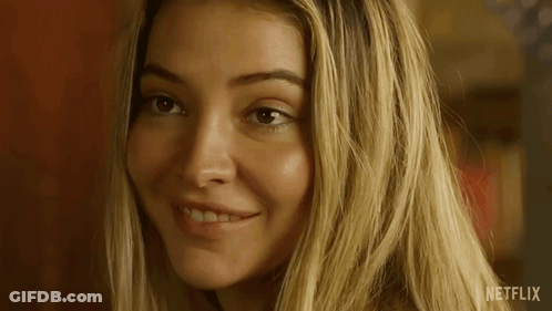 A Close Up Of A Woman 'S Face With Netflix Written In The Corner GIF