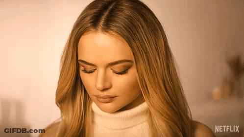 A Close Up Of A Woman 'S Face With Netflix Written On The Bottom GIF