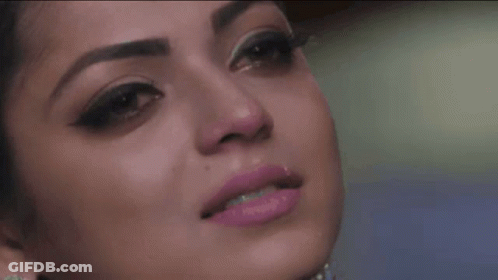 A Close Up Of A Woman 'S Face With Pink Lipstick On GIF