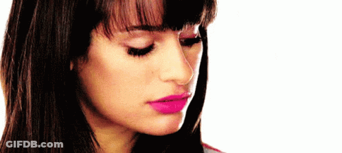 A Close Up Of A Woman 'S Face With Pink Lipstick On GIF
