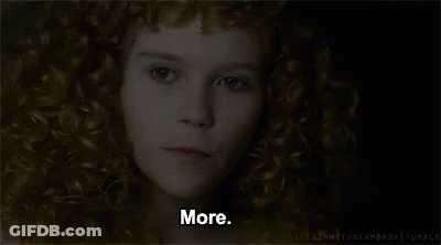 A Close Up Of A Woman 'S Face With Red Curly Hair And The Words `` More '' . GIF