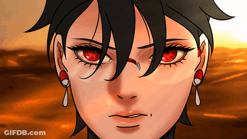 A Close Up Of A Woman 'S Face With Red Eyes And Earrings GIF