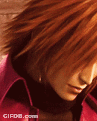 A Close Up Of A Woman 'S Face With Red Hair And A Pink Jacket GIF