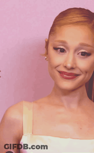A Close Up Of A Woman 'S Face With Red Lips GIF