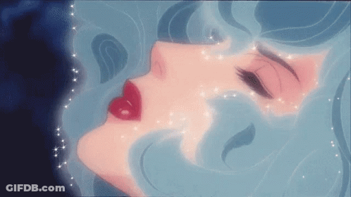 A Close Up Of A Woman 'S Face With Red Lips And Blue Hair . GIF