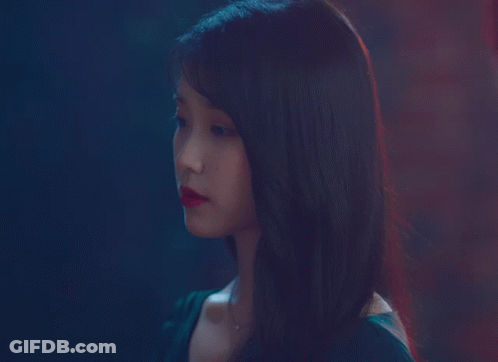A Close Up Of A Woman 'S Face With Red Lips GIF