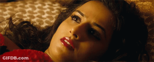 A Close Up Of A Woman 'S Face With Red Lips GIF