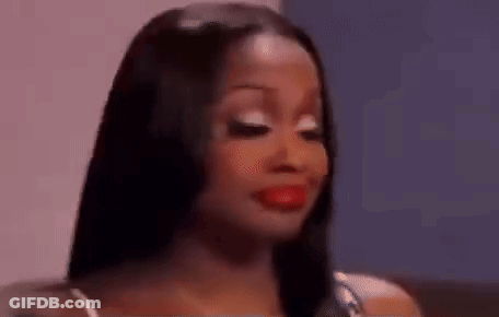 A Close Up Of A Woman 'S Face With Red Lipstick . GIF