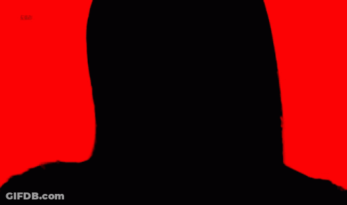 A Close Up Of A Woman 'S Face With Red Lipstick And A Red Background GIF