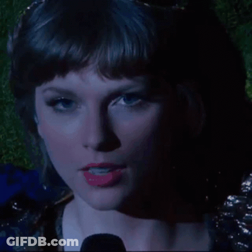 A Close Up Of A Woman 'S Face With Red Lipstick GIF