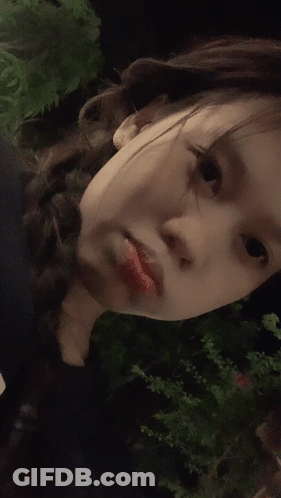 A Close Up Of A Woman 'S Face With Red Lipstick On GIF