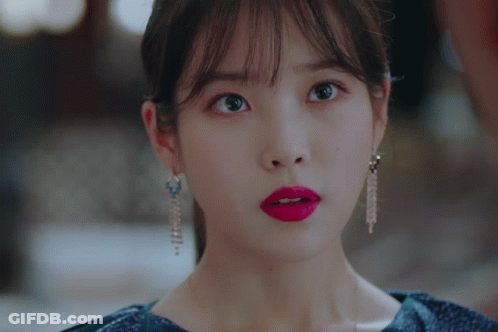 A Close Up Of A Woman 'S Face With Red Lipstick GIF